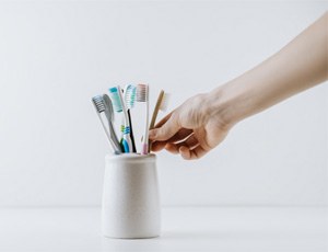 Taking a toothbrush out of the toothbrush holder