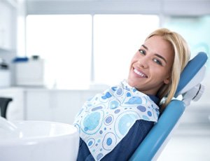 Female dental patient leaning back in chair