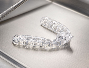 Clear mouthguard on metal tray
