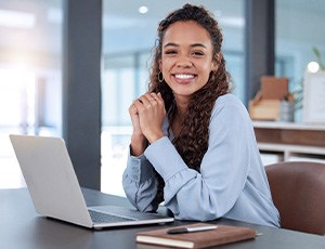 Person holding Invisalign aligner in Richardson