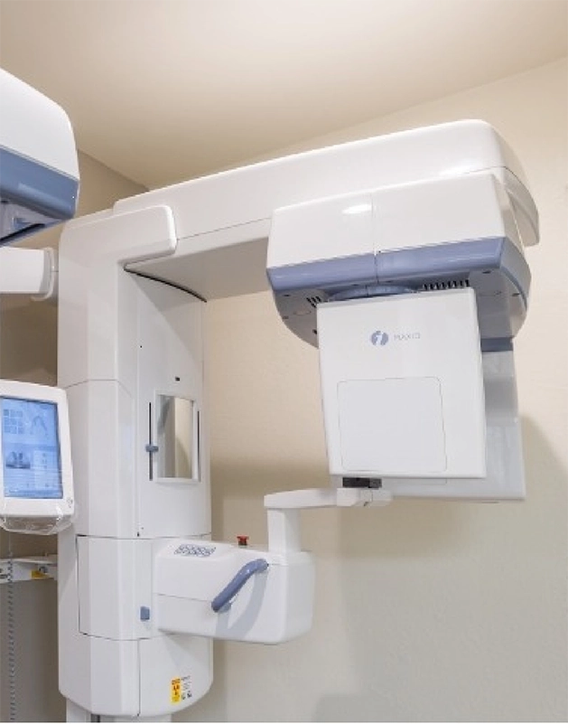 Cone beam scanner standing against a wall