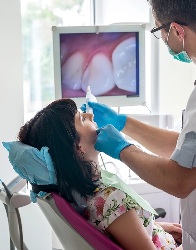 Dentist taking a close-up photo of a patient's teeth