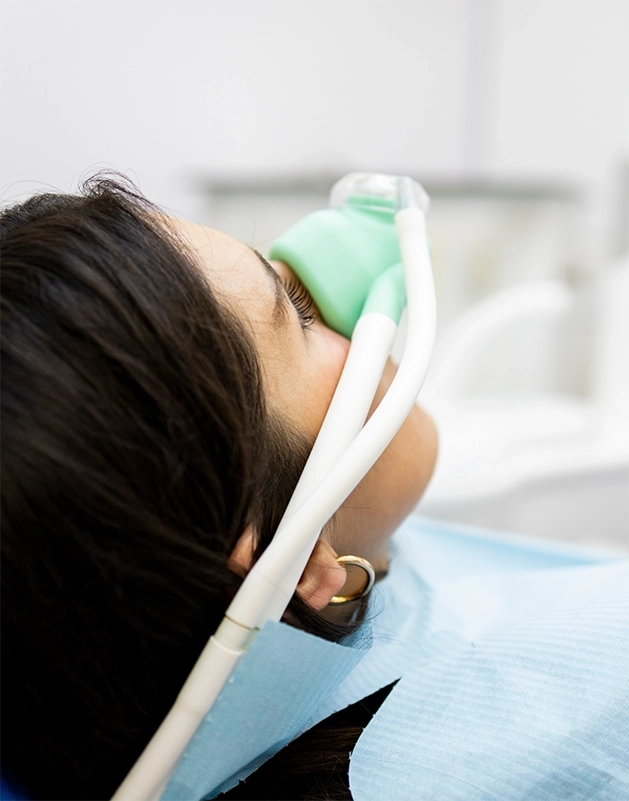 Dental patient wearing a nitrous oxide mask