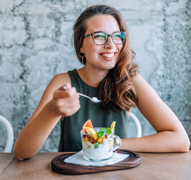 Woman eating a parfait