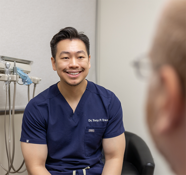Doctor Tran smiling at a patient