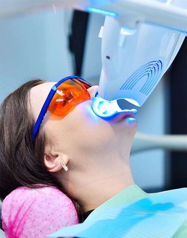 Dental patient getting her teeth whitened